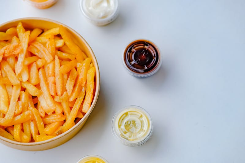 Crispy seasoned fries with dipping sauces