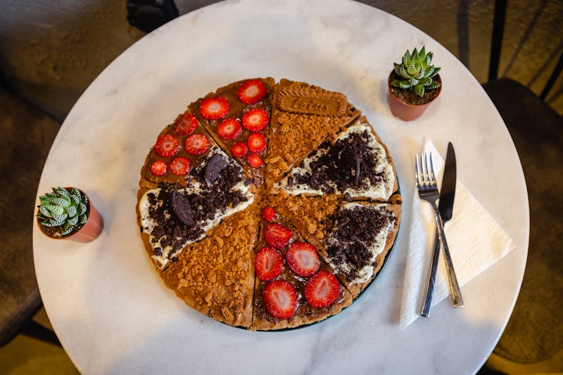 Nutella pizza dessert with fresh strawberries